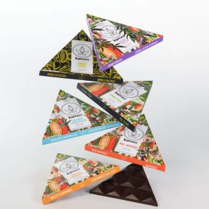 Master box of 216 Kamm assorted dark chocolate bars featuring a variety of botanical flavors, sugar free and vegan for USA & Canada
